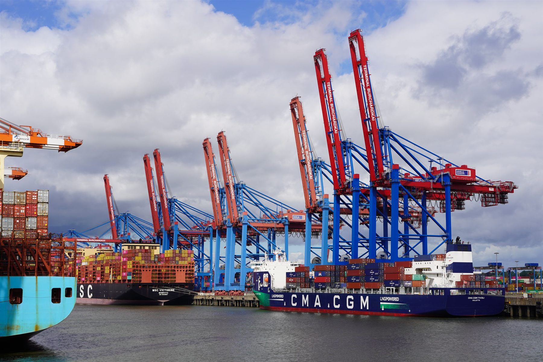 Container ship being loaded at a port terminal